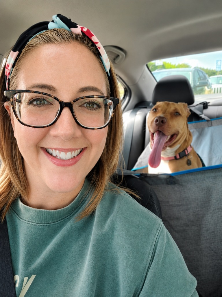 Rockell and Bella on a car ride, Bella grinning in the backseat